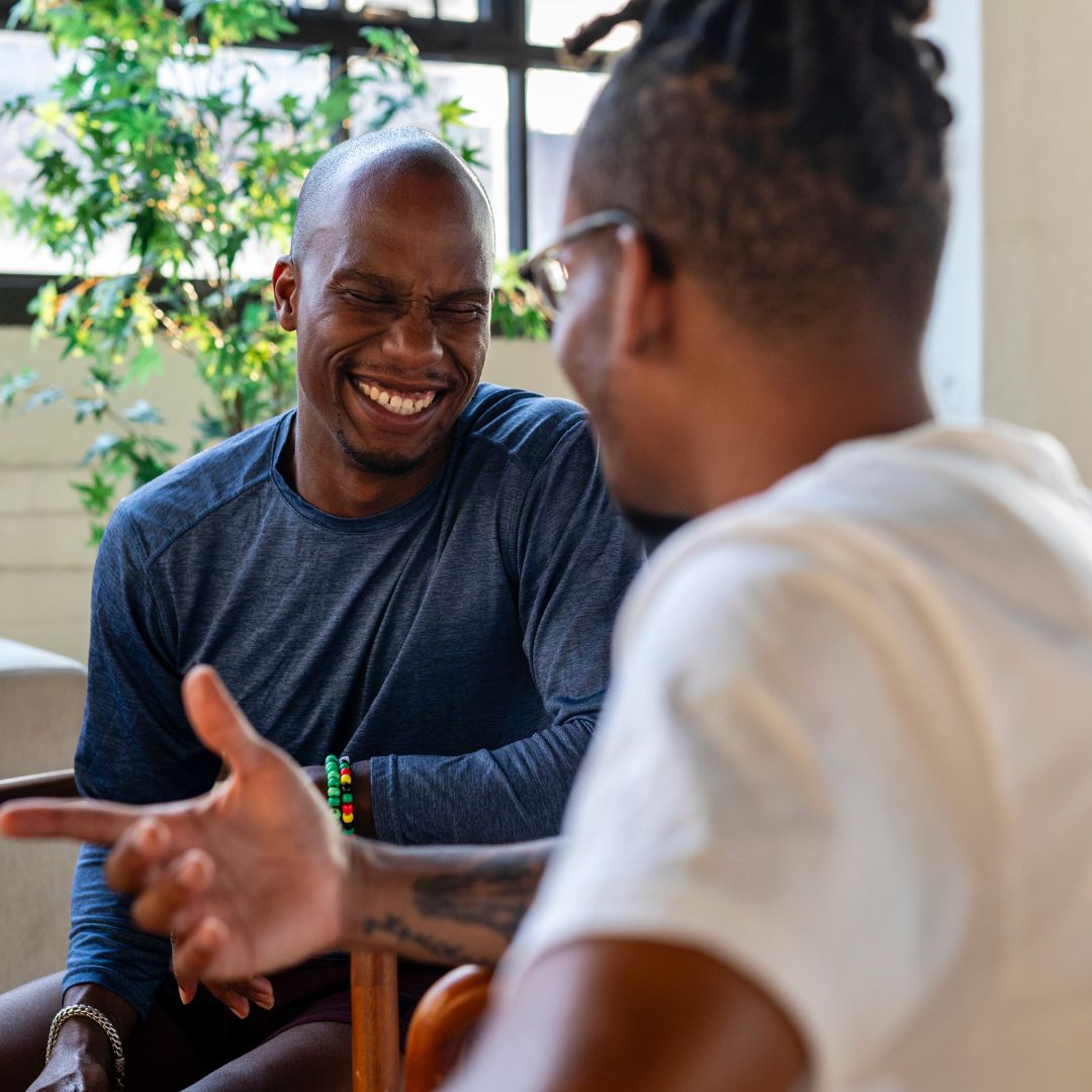 two men smiling together